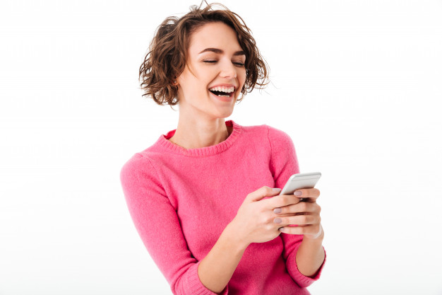 Free: Portrait of an excited pretty girl playing games Free Photo 